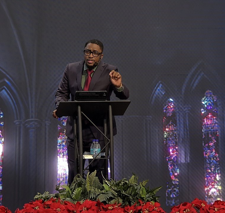 Pastor Charles preaching Follow the Leader